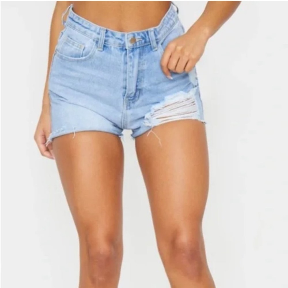 Pretty Little Thing light blue wash distressed denim mom shorts